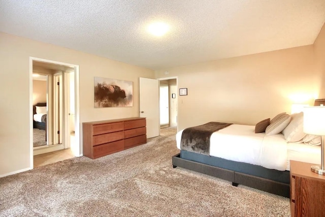 carpeted bedroom with a textured ceiling