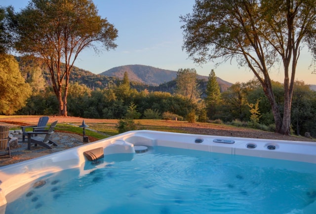 view of swimming pool featuring a mountain view