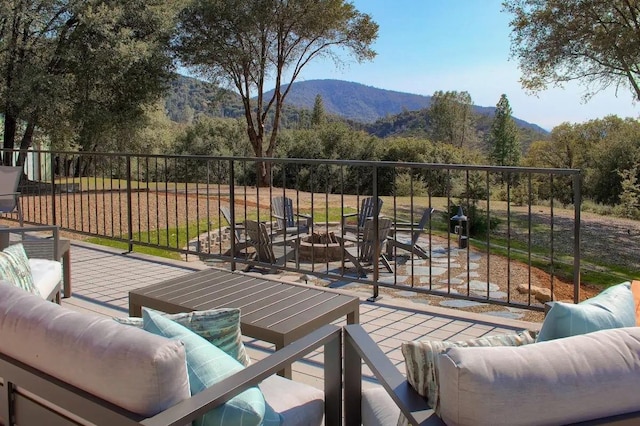 deck featuring a mountain view and outdoor lounge area