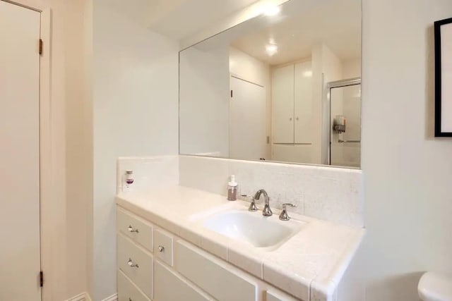 bathroom with toilet and vanity