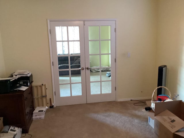 doorway featuring carpet flooring and french doors