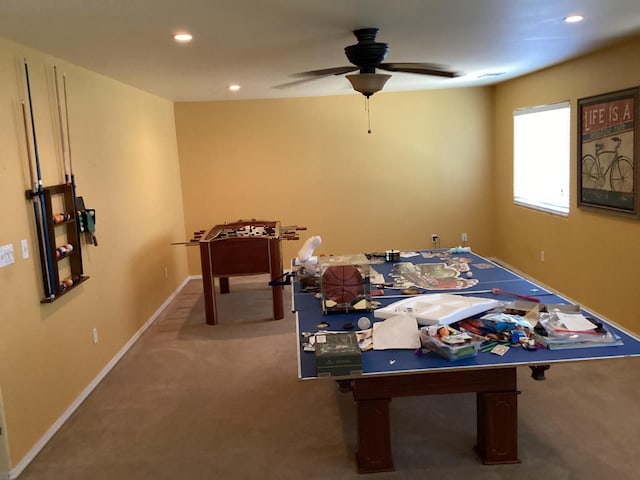 rec room with ceiling fan and carpet floors