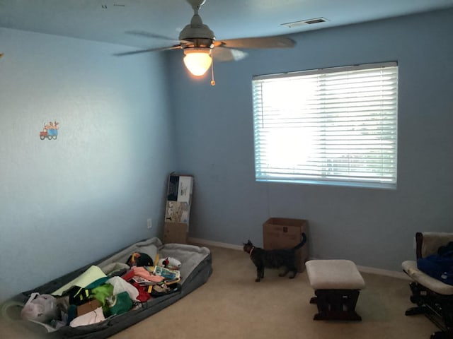 carpeted bedroom with ceiling fan