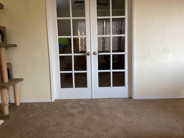 interior details featuring carpet flooring and french doors