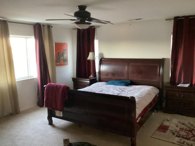 bedroom featuring ceiling fan and light colored carpet