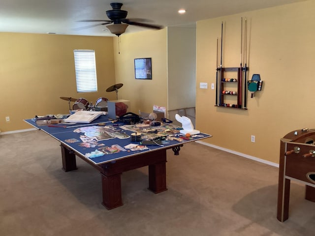 recreation room featuring ceiling fan and carpet