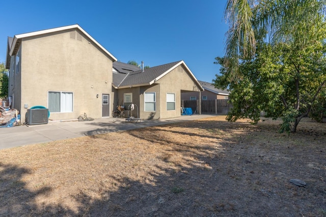 back of house featuring a patio area and central AC unit