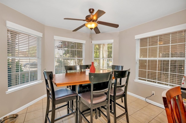 tiled dining room with ceiling fan