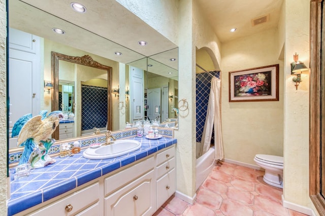 full bath featuring vanity, visible vents, tile patterned floors, toilet, and shower / tub combo with curtain