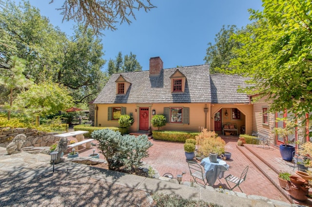 view of front of house with a chimney