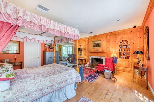 bedroom featuring visible vents and hardwood / wood-style flooring