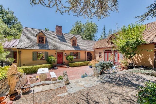 view of front of property with a chimney