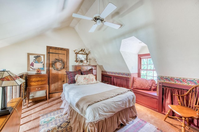 carpeted bedroom with vaulted ceiling