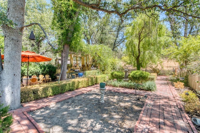 view of patio / terrace featuring fence