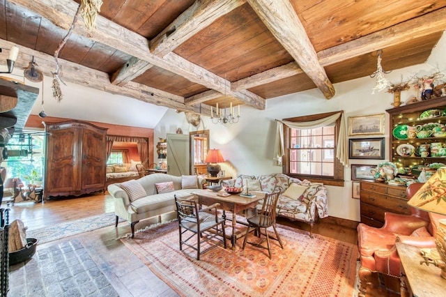 living room featuring a wealth of natural light, beamed ceiling, and wood ceiling