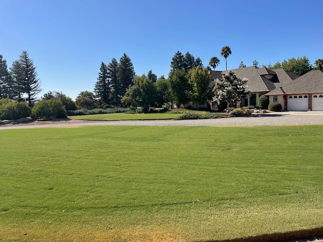 view of yard featuring a garage