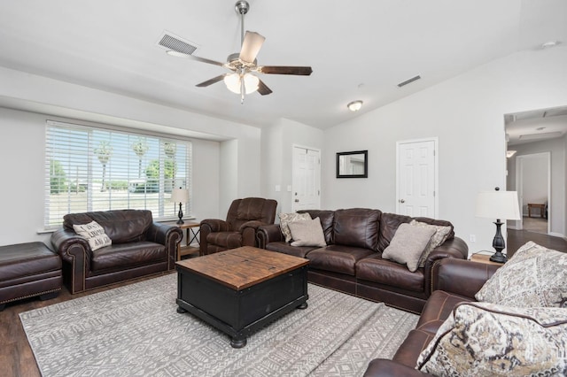 living room featuring vaulted ceiling, hardwood / wood-style flooring, and ceiling fan