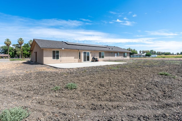 back of property with a patio area