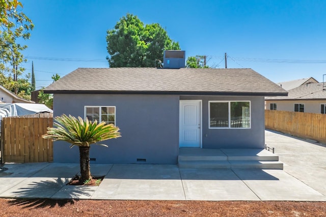 1845 N 10th Ave, Hanford, CA 93230 - view of front facade with a shingled roof, stucco siding, and a patio area