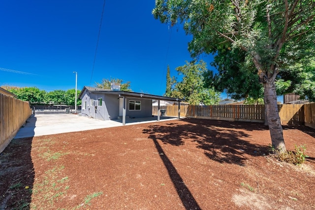 back of property with a patio