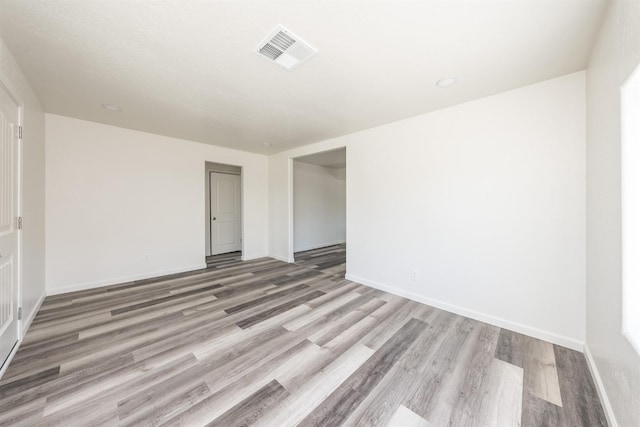 spare room featuring light wood-type flooring