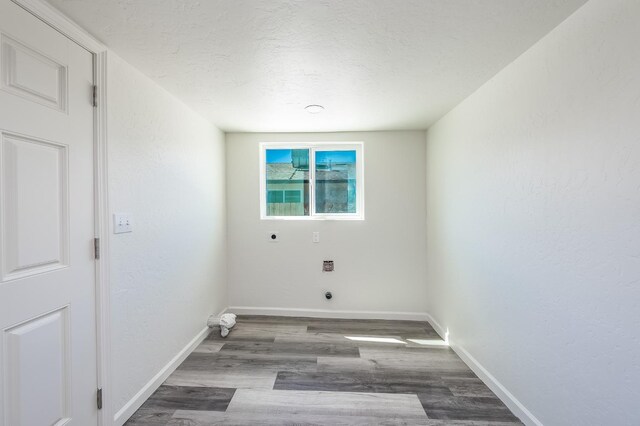 1845 N 10th Ave, Hanford, CA 93230 - washroom featuring electric dryer hookup, wood finished floors, baseboards, and a textured ceiling