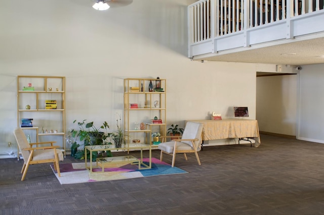 interior space featuring ceiling fan and dark parquet floors