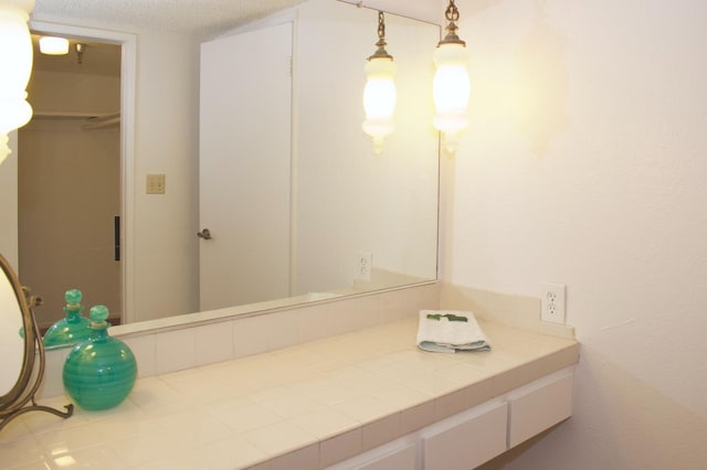 bathroom featuring a textured ceiling