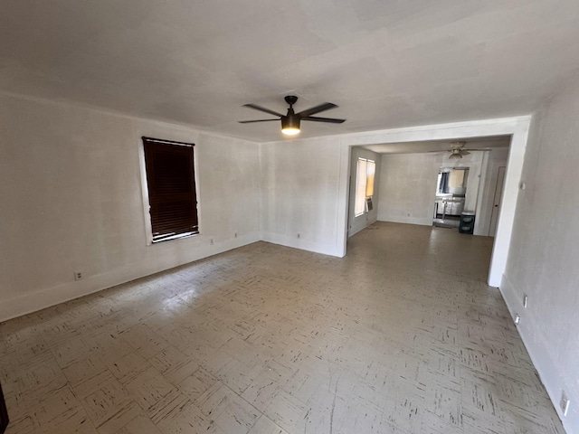 empty room featuring ceiling fan