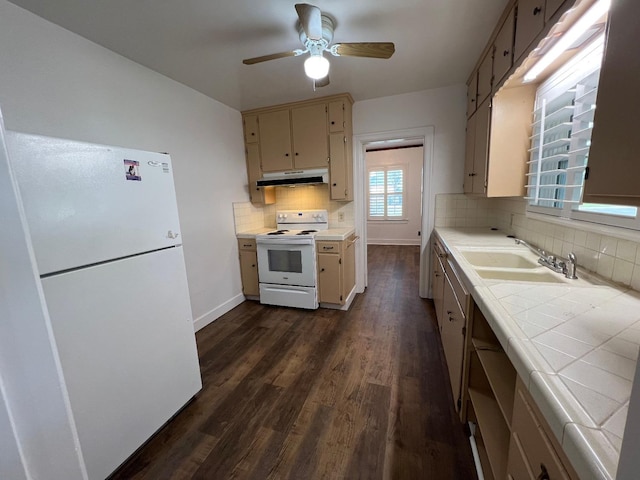 kitchen featuring tasteful backsplash, white appliances, sink, cream cabinets, and tile countertops