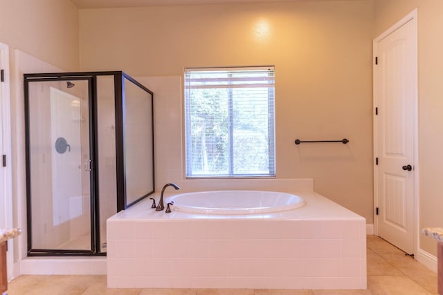 bathroom featuring tile patterned flooring and plus walk in shower