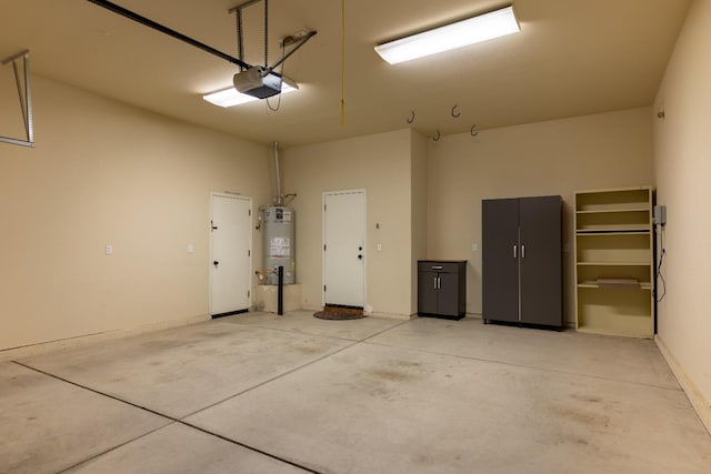 garage with strapped water heater and a garage door opener