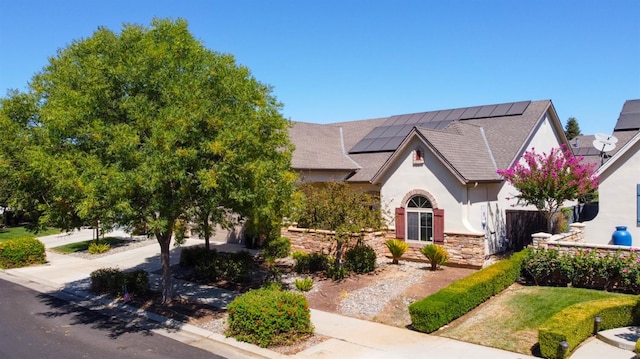 view of front of house with solar panels