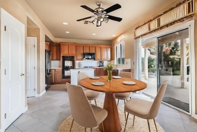 dining room with light tile patterned floors, ceiling fan, visible vents, and recessed lighting