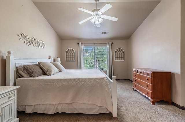 bedroom featuring light colored carpet, lofted ceiling, visible vents, and ceiling fan