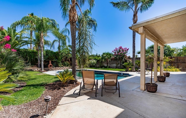 view of patio / terrace with a fenced backyard and a fenced in pool