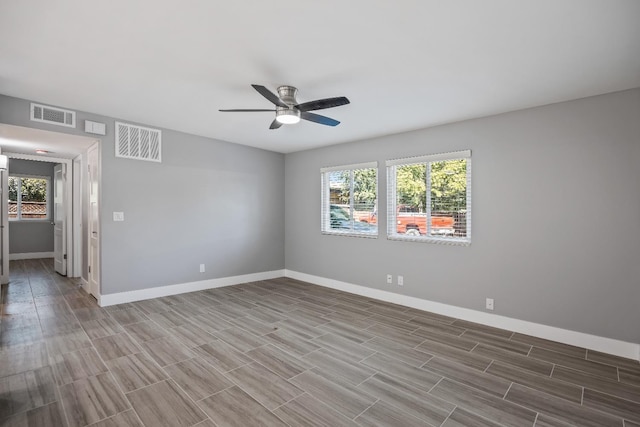 spare room with ceiling fan