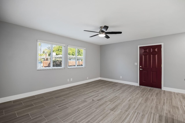 unfurnished room with ceiling fan