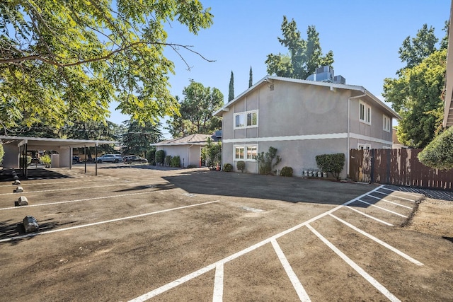 view of vehicle parking featuring a carport