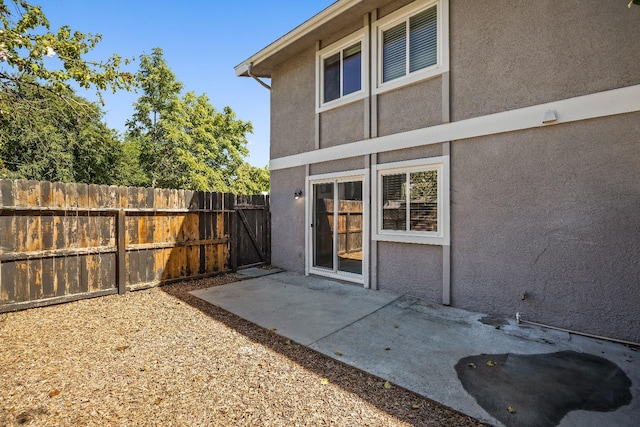 back of property with a patio