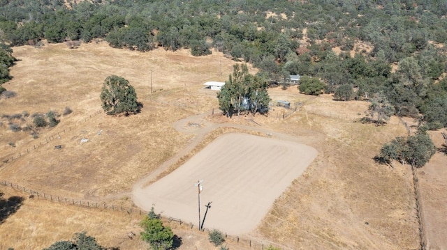 birds eye view of property with a rural view