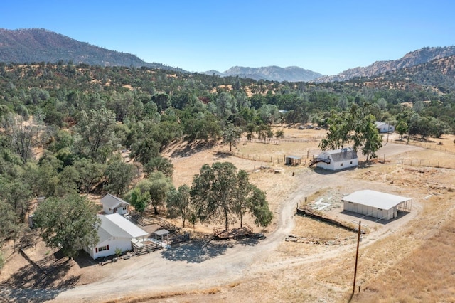 drone / aerial view with a mountain view and a rural view