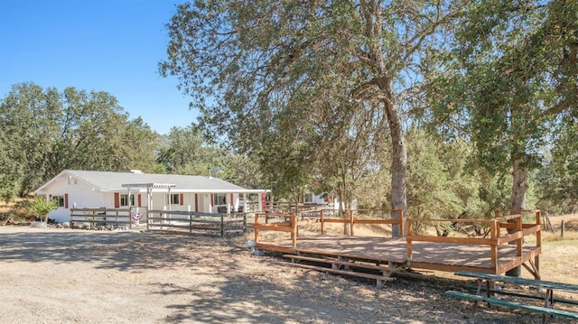 view of front of home featuring a wooden deck