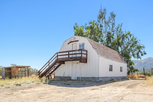 view of barn with a mountain view