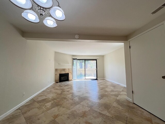 unfurnished living room with tile patterned flooring and a fireplace