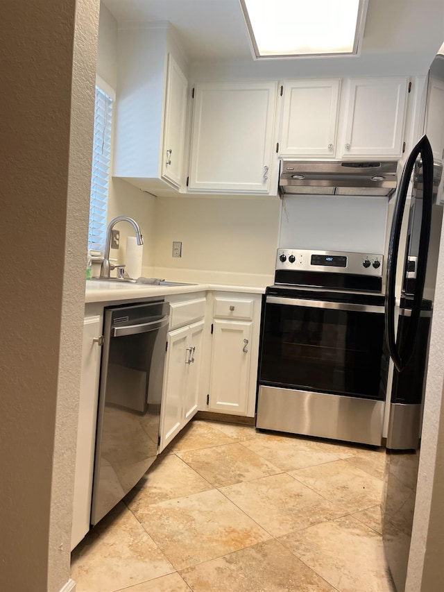 kitchen featuring stainless steel appliances, light countertops, white cabinetry, a sink, and under cabinet range hood