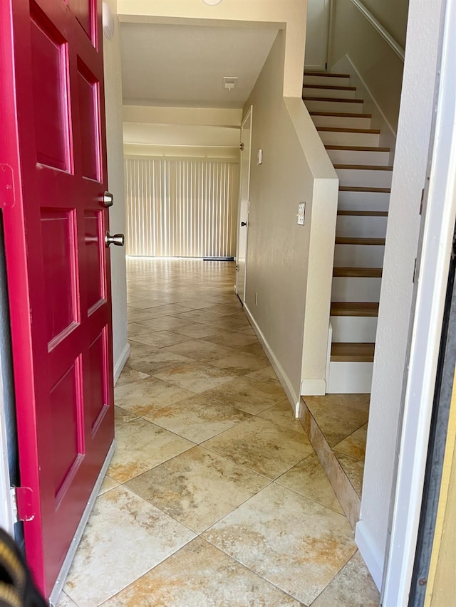 corridor featuring tile patterned flooring