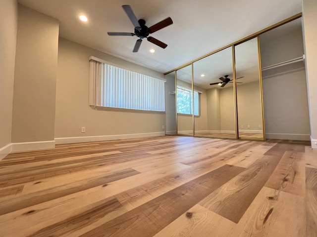 unfurnished bedroom featuring baseboards, ceiling fan, light wood finished floors, and recessed lighting