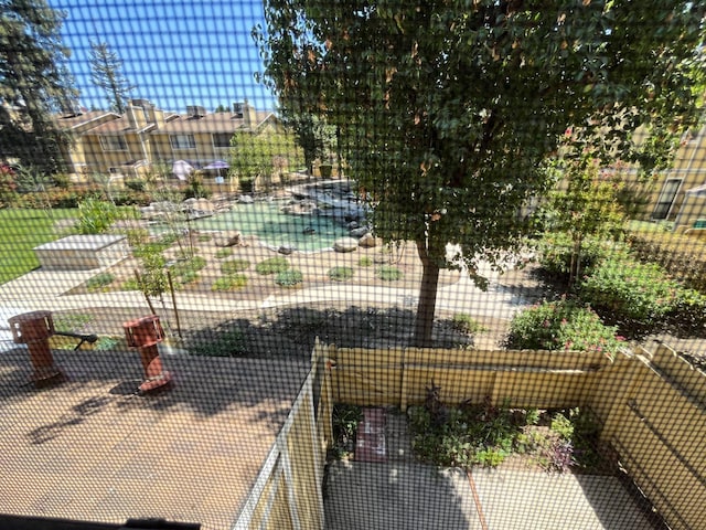 view of sport court with fence