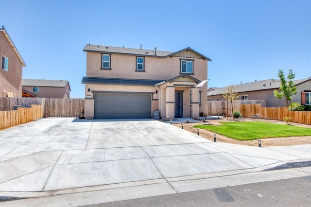 view of front of house featuring a garage and a front lawn